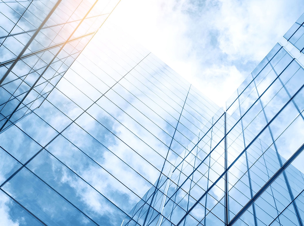 glass,buildings,with,cloudy,blue,sky,background