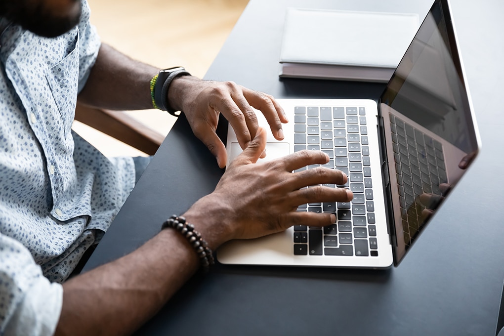 close,up,top,view,of,african,american,young,man,typing