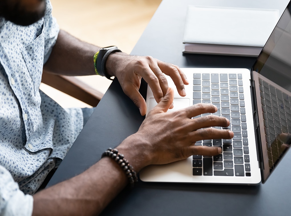 close,up,top,view,of,african,american,young,man,typing