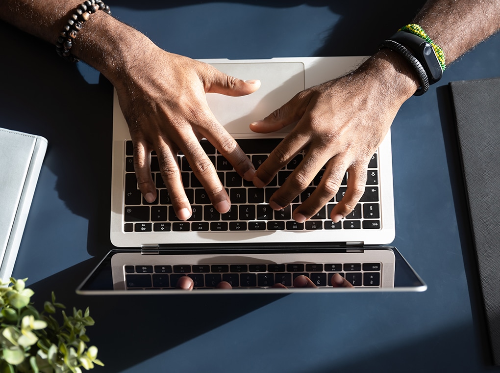 african,ethnicity,businessman,hands,typing,using,laptop,close,up,view