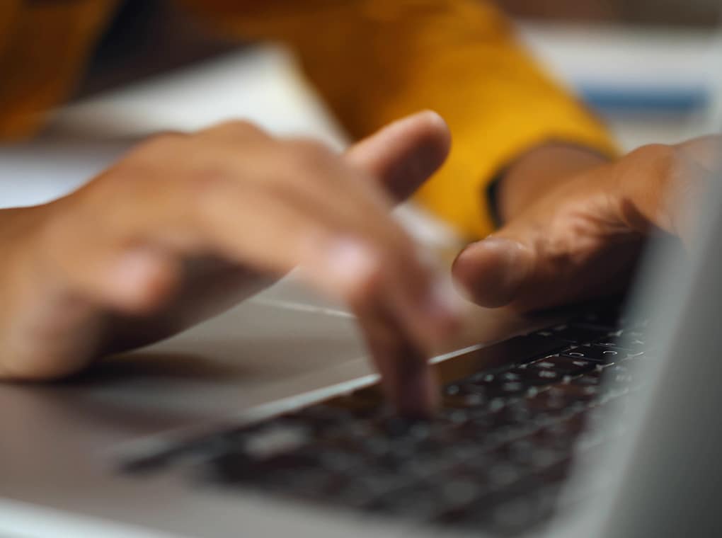 close,up,of,african,child,browsing,internet,on,laptop.,hands