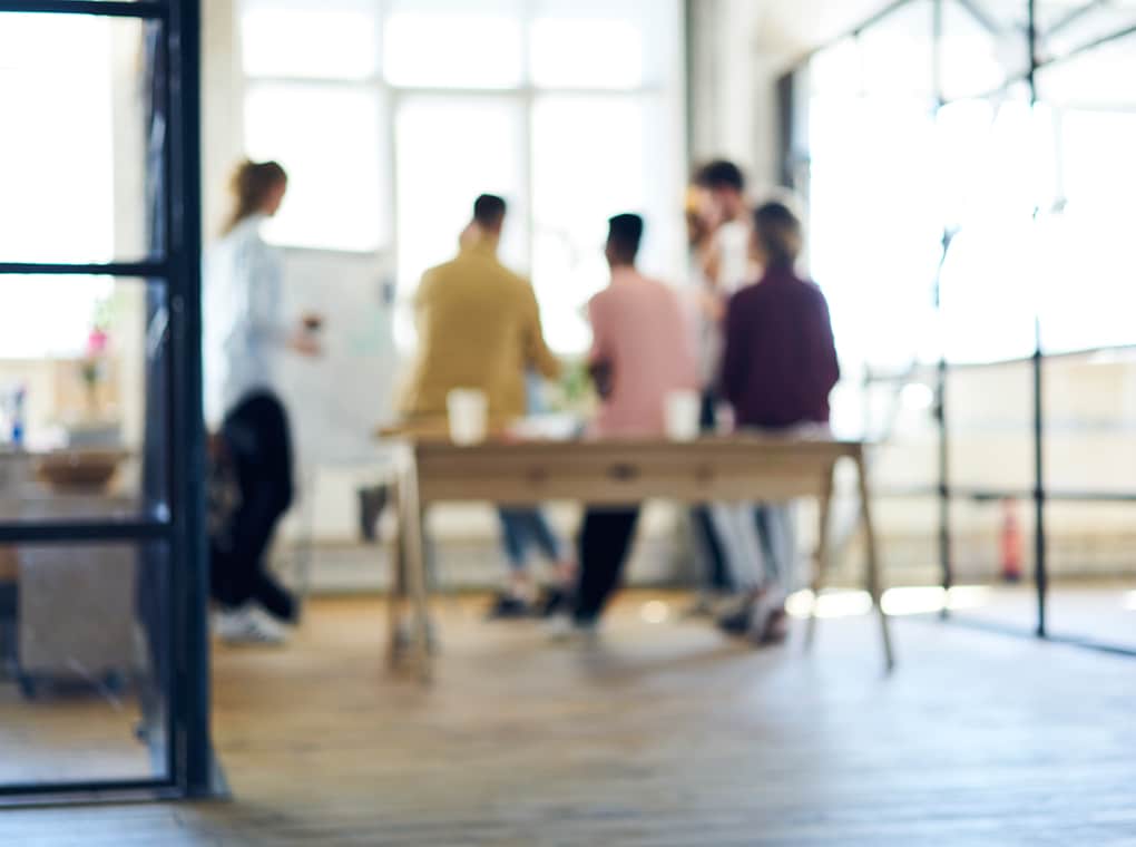 blurred,image,,people,silhouette,collaborating,in,office,interior.,defocused,space