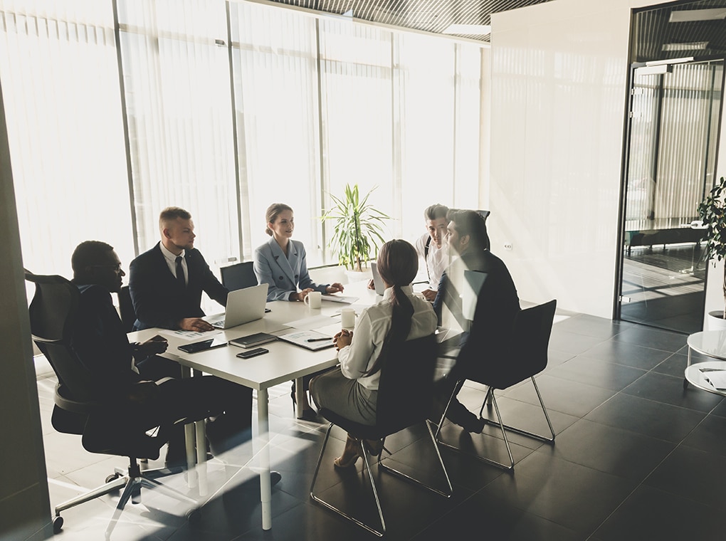 silhouettes,of,people,sitting,at,the,table.,a,team,of