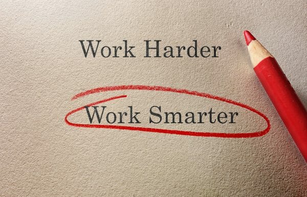 An imaged of two choices typed on a piece paper, Work Harder and Work Smarter. Work smarter has been circled with a red pencil.